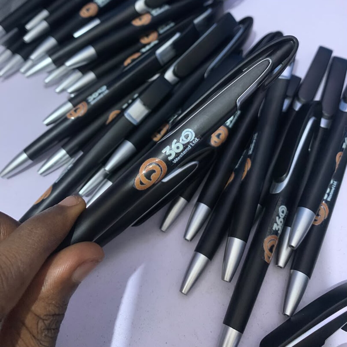 Black branded plastic pens