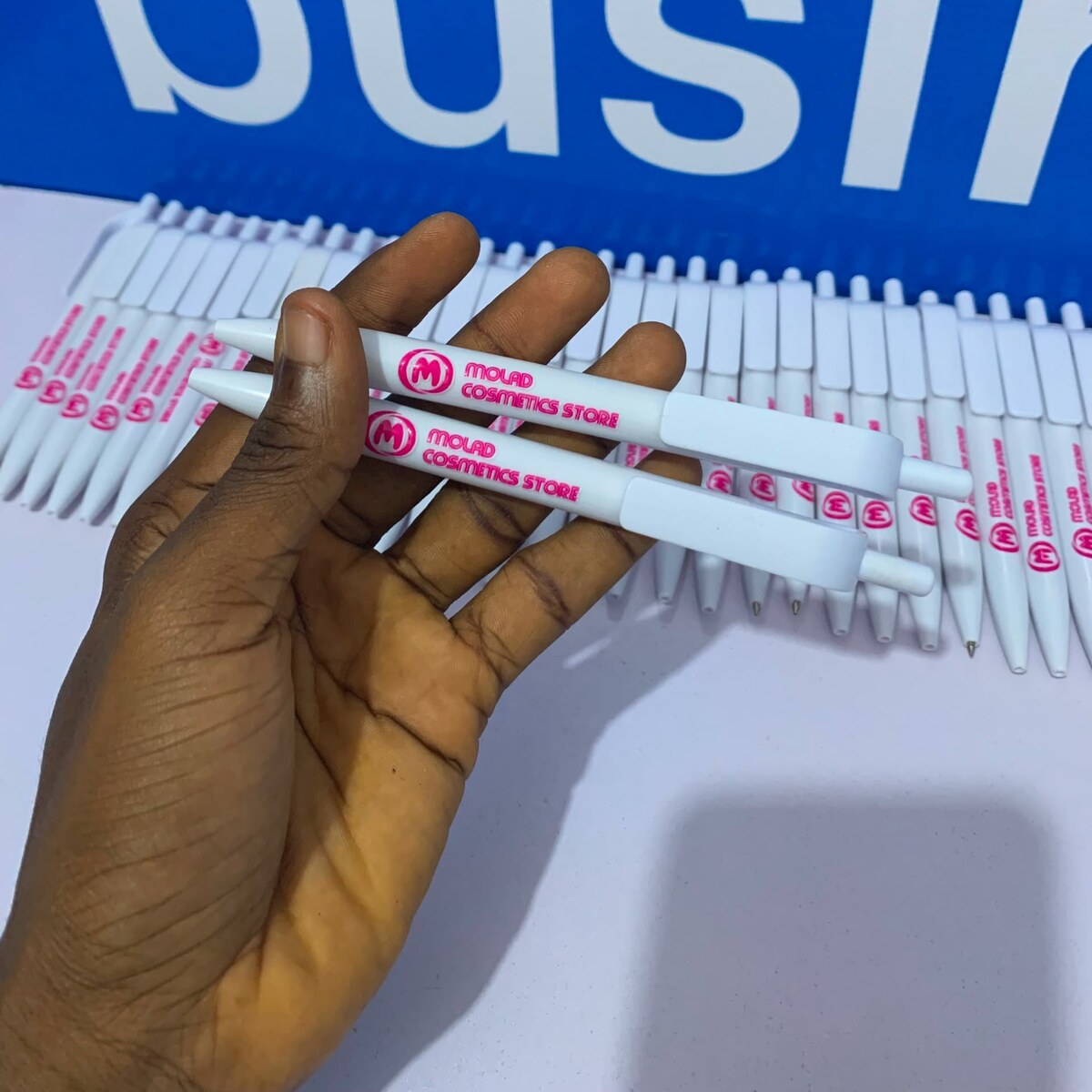 White branded plastic pens